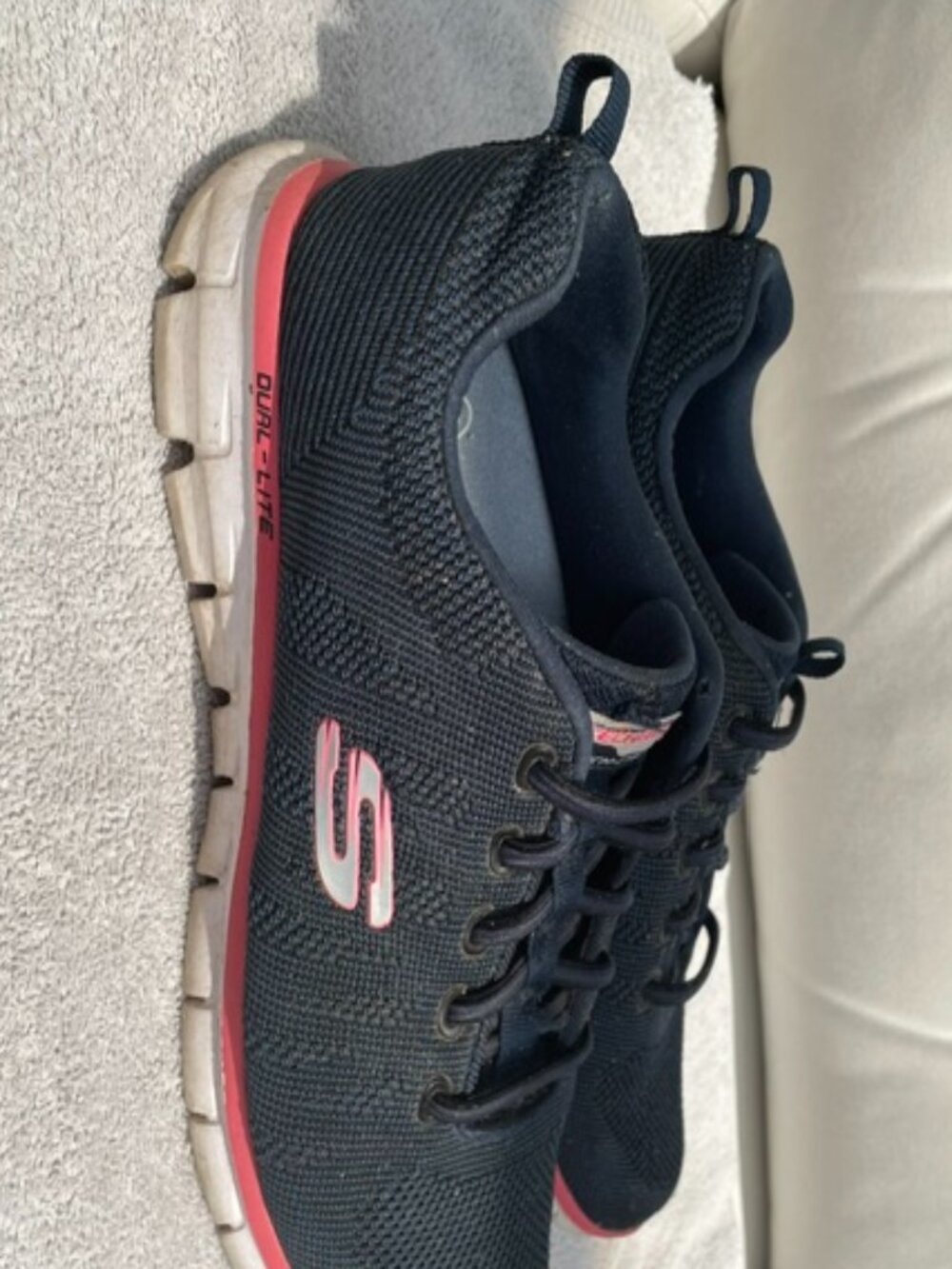 Women's blue sketcher sneakers with pink trim, size 8.5